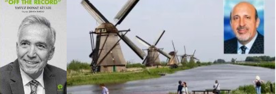 Afbeelding met person, windmolen, tekst, pak Automatisch gegenereerde beschrijving